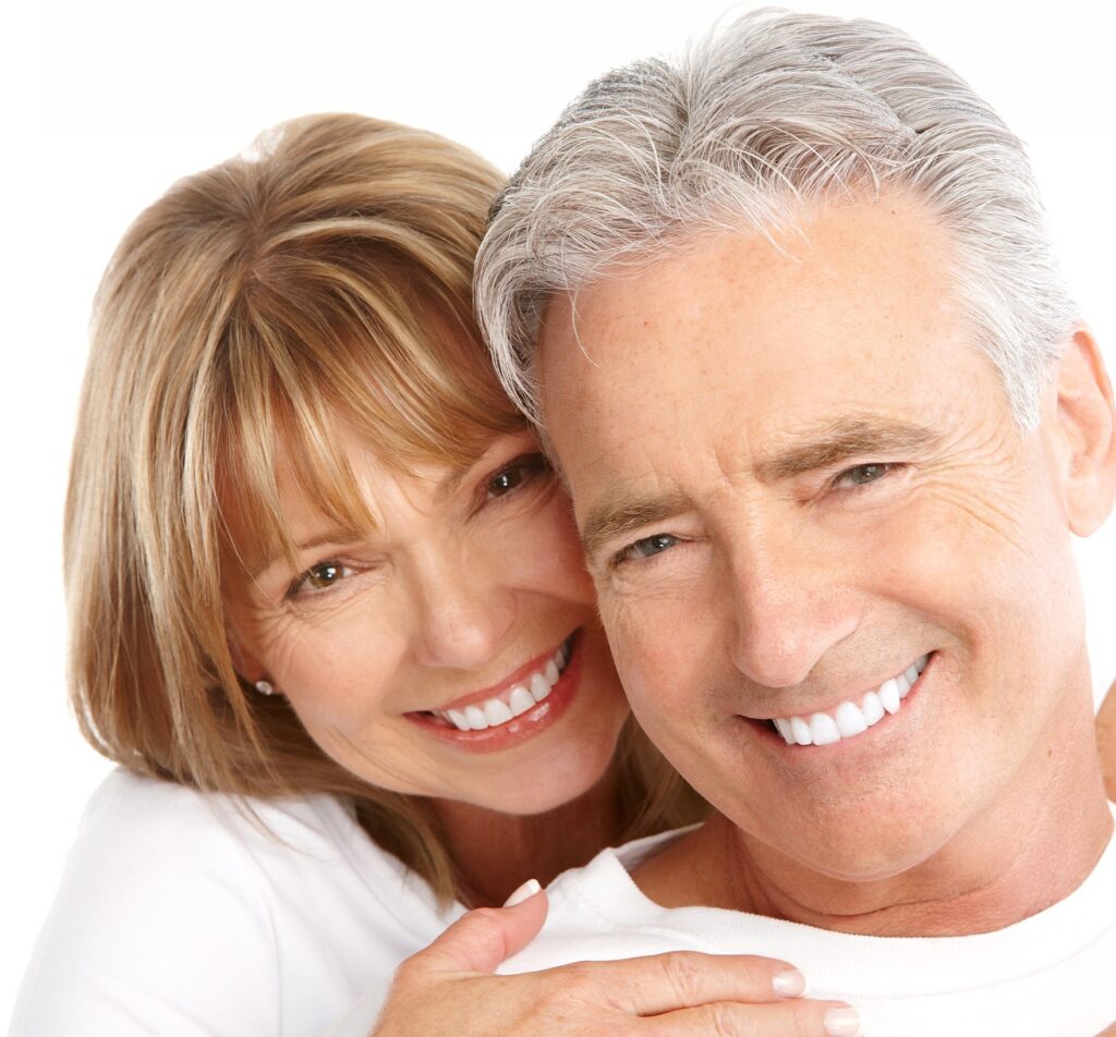 A happy older couple smiles together, conveying warmth and affection, highlighting themes of love and companionship.